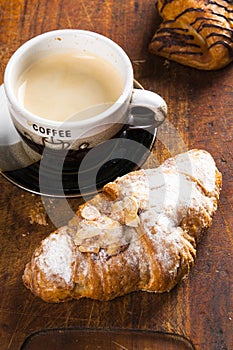 Fun cakes on wood background with coffee