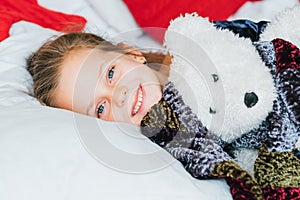 Fun childhood girl bed teddy bear gift smiling