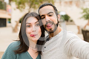 Fun couple making silly faces
