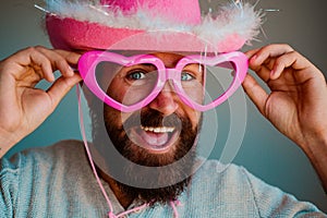 Fun cowboy. Happy man with funny pink glasses smile face closeup. Handsome smiling young guy. Positive human facial