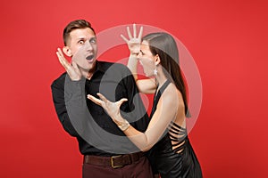 Fun expression young couple in black clothes shirt dress celebrating birthday holiday party on bright red