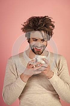 Fun faces Happy guy with tea cup on pink background.