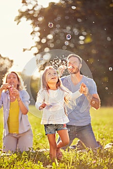 Fun for female child with soap bubbles