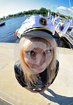 Fun fisheye view on girl looking as seamen photo