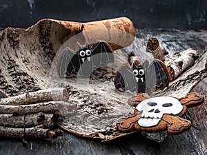 Fun Halloween dessert idea - cute scary cookies on a dark stone background