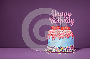 Fun happy birthday drip cake over a purple background