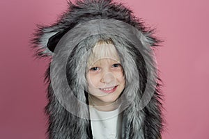 The fun hat design is sure to entertain. Small girl wear winter hat scarf. Small fashionista. Happy child smile in