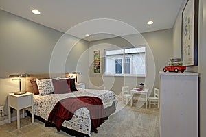 Fun kids bedroom design with soft blue walls