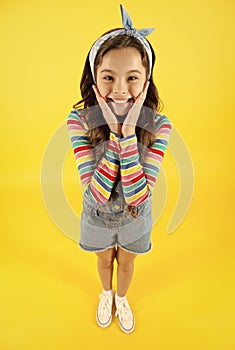 Fun lifestyle little girl long hair denim overalls, summer concept