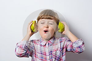 Fun little girl listens to music