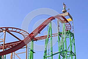 Fun Parc with the roller-coaster - isolated, blue sky in the background