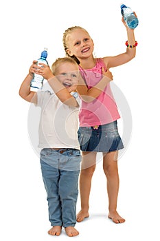 Fun playful kids holding bottle with water isolated on white