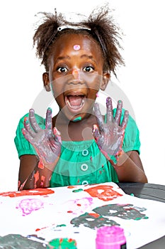 Fun portrait of African kid painting