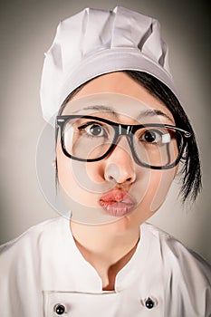 Fun portrait of chef making a kissing gesture