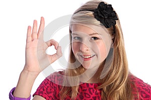 Fun positive okay hand sign by happy school girl