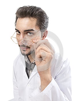 A fun shot of a confident person in a lab coat looking through his glasses with acknowledgment and expertise.