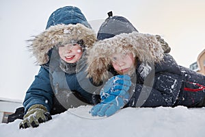 Fun in the snow. Children are outdoors, winter day