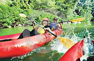 Fun splashing canoe river photo