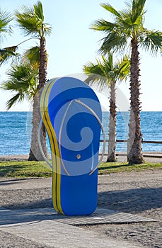 Fun in the sun. Beach shower in the shape of a flip-flop.