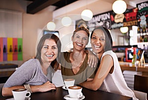 Fun with their besties. Portrait of three friends having fun at a coffee shop together.