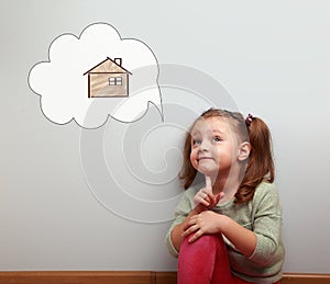 Fun thinking kid looking up on idea cloud bubble with new future