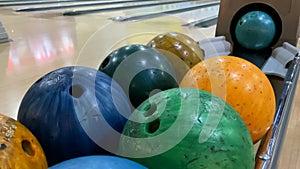 Fun for the whole family. Multi-colored bowling balls close-up.