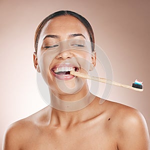 Fun woman, face or toothbrush on studio background in dental care, hygiene grooming or mouth healthcare. Happy smile