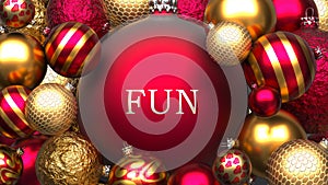 Fun and Xmas, pictured as red and golden, luxury Christmas ornament balls with word Fun to show the relation and significance of