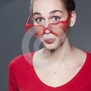 Fun young girl with heart-shape glasses