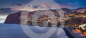 Funchal city at night near Praia Formosa beach, Madeira - Portugal