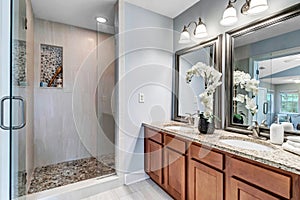 Functional master bathroom with grey tile