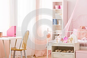 Functional pink room with bed