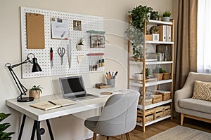 Interior of home office with pegboard workspace