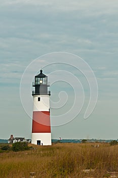 Functioning lighthouse on barrier isalnd in north atlantic ocean