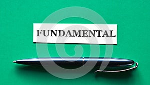 FUNDAMENTAL - word on a green background with a black handle