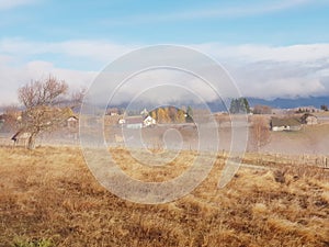 Fundata village in Romania, Eastern Europe fog houses autumn Golden