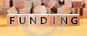 Funding Word Written In Wooden Cube, business concept