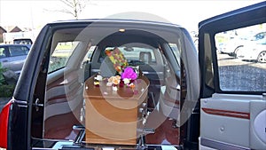 Funeral casket in a hearse or chapel or burial at cemetery