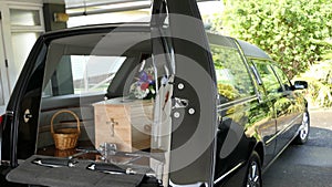 Funeral casket in a hearse or chapel or burial at cemetery