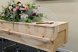 Funeral casket in a hearse or chapel or burial at cemetery