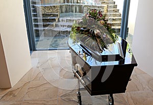 Funeral casket in a hearse or chapel or burial at cemetery