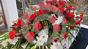 A funeral casket in a hearse or chapel or burial at cemetery