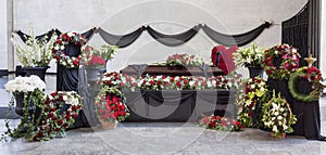 Funeral, coffin, decorated with wreaths, in the farewell hall, panorama.