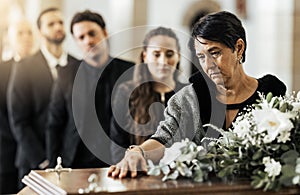 Funeral, death and coffin in church or Christian family gathering together for support. Religion, sad people and