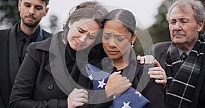 Funeral, death and support for a woman with a flag at a cemetery in mourning at a memorial service. Sad, usa and an army