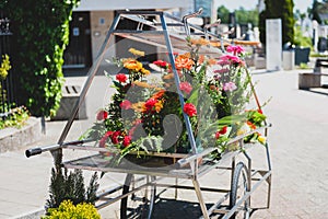 Funeral flower cart or trolley at the burial cemetery