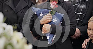 Funeral, graveyard and woman with American flag for veteran for respect, ceremony and memorial service. Family