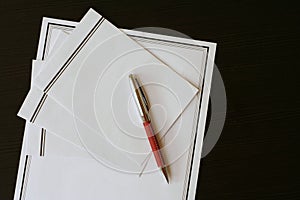 Funeral notice (card) and envelopes on the black table