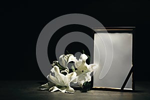 Funeral photo frame and lily flowers