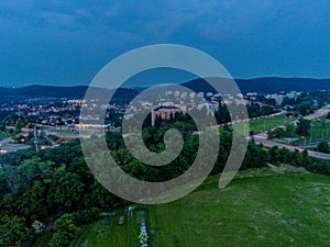 Funfair by dam Lake in Brno from above at dusk, Czech Republic